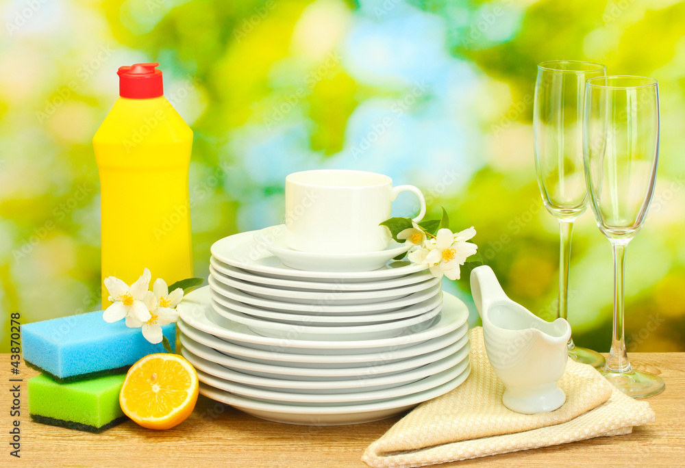 empty clean plates, glasses and cups with dishwashing liquid, Stock ...
