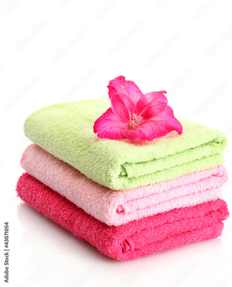 bright towels and flower isolated on white bright towels and flower isolated on white