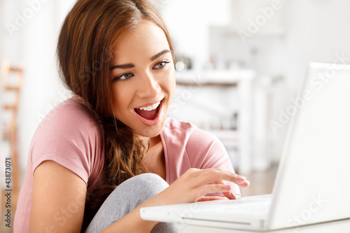 attractive young teenager surfing the internet photo