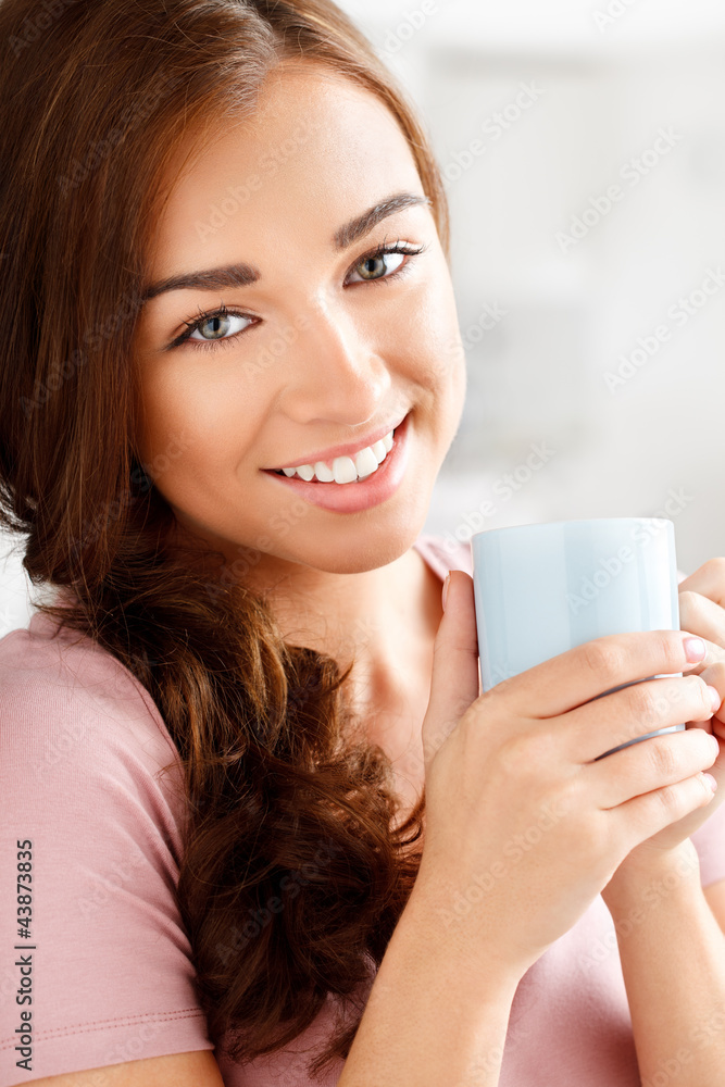 attractive young woman drinking coffee at home attractive young woman drinking coffee at home