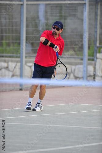 Middle-Aged Tennis Player © PROMA