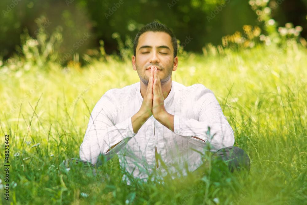 Medieval young man praying in a forest-SMALL DOF Medieval young man praying in a forest-SMALL DOF