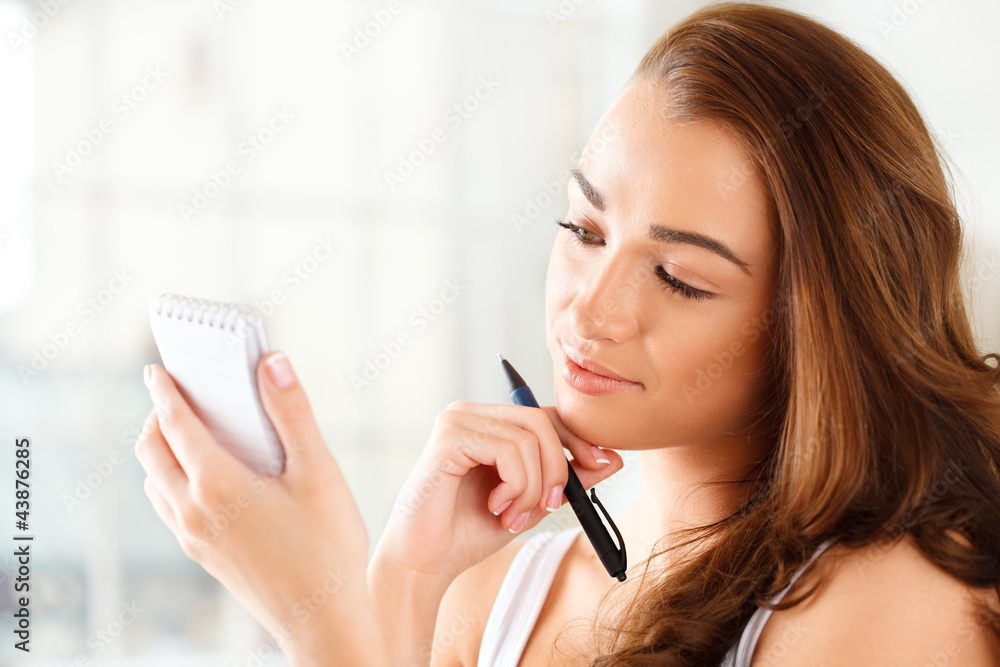 Attractive young student planning ahead Attractive young student planning ahead