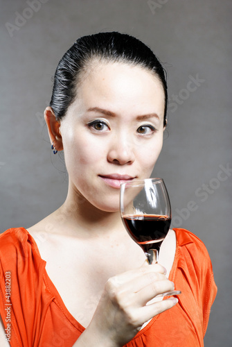 Beautiful woman with glass red wine