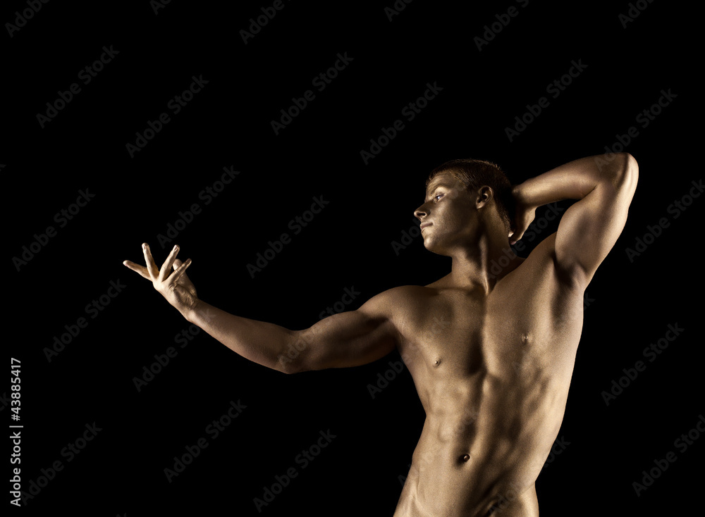 Strong athletic man portrait with metal skin