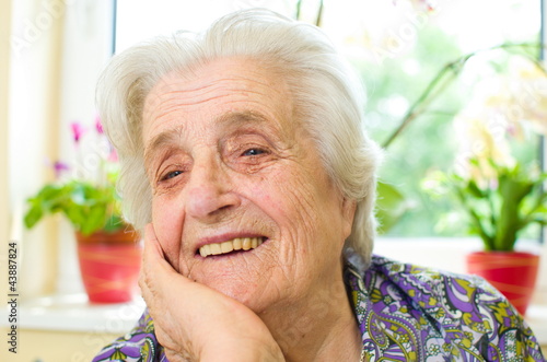 Happy old gray-haired woman