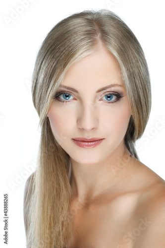 Closeup portrait of young woman with beautiful blue eyes on whit