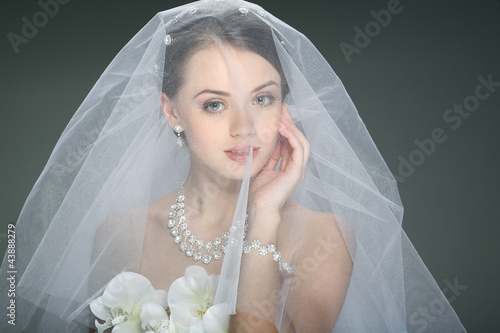 A beautiful young girl is in a wedding decoration