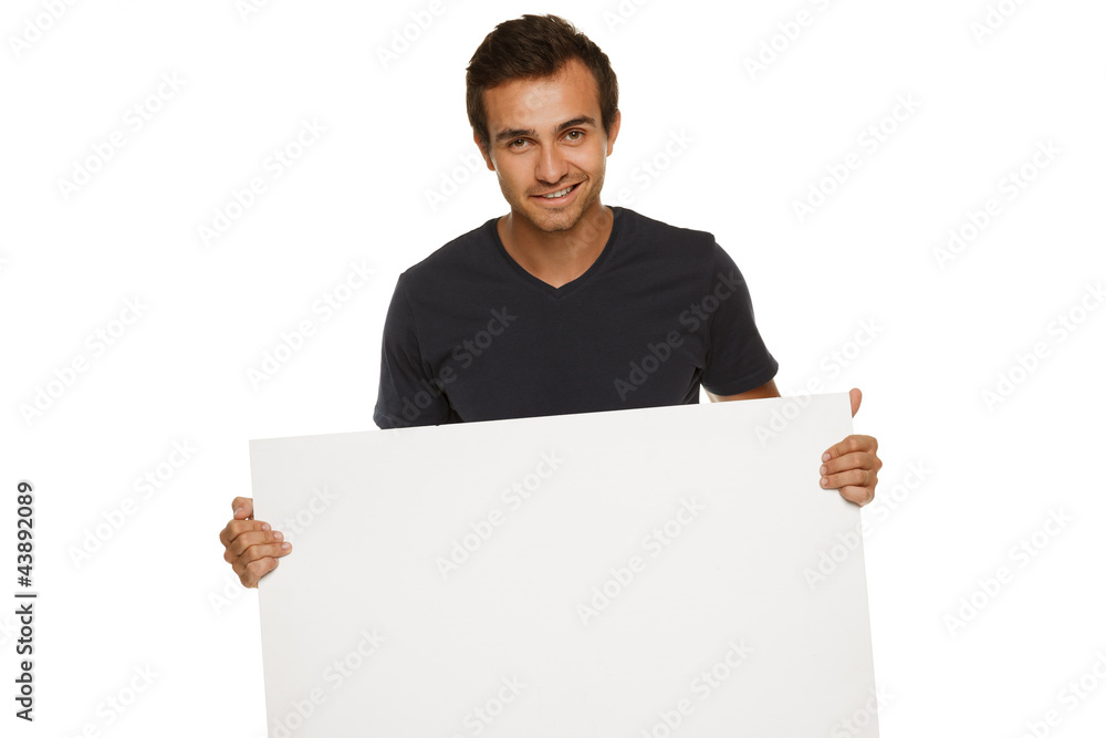 Young man holding blank banner Young man holding blank banner