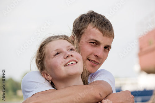 The guy embraces the girl photo