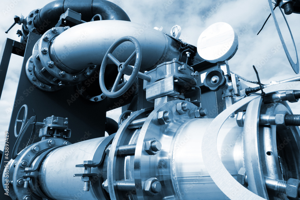 industrial pipelines and valve in blue tones industrial pipelines and valve in blue tones