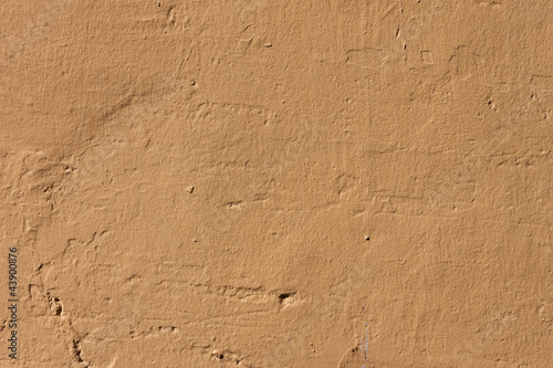 Simple yellowed plaster cement wall background