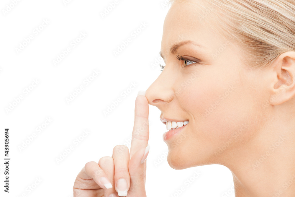 happy woman with finger on lips happy woman with finger on lips