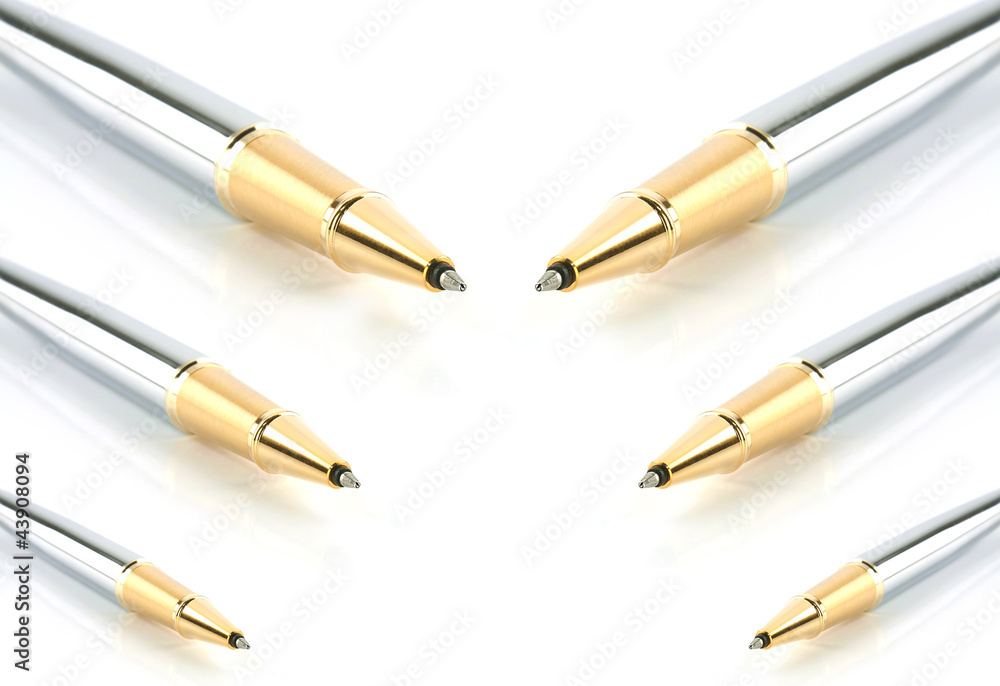 gold shining pens isolated on white background gold shining pens isolated on white background