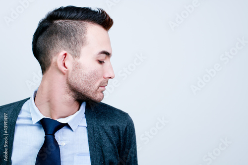 closeup portrait of handsome young adult man - side view profile