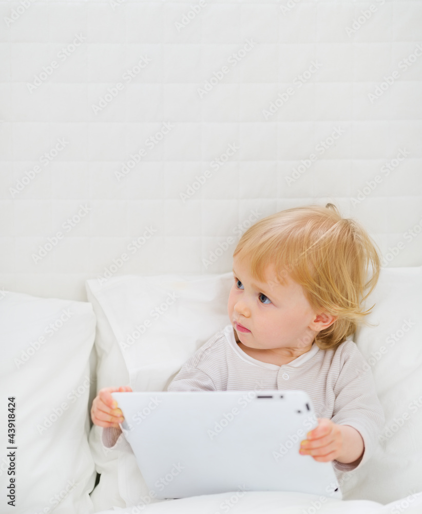 Modern baby with tablet PC Modern baby with tablet PC