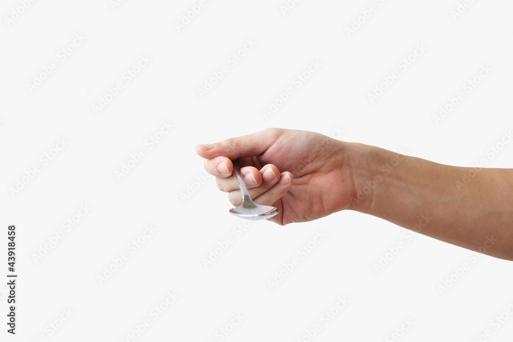 a spoon in a hand a spoon in a hand