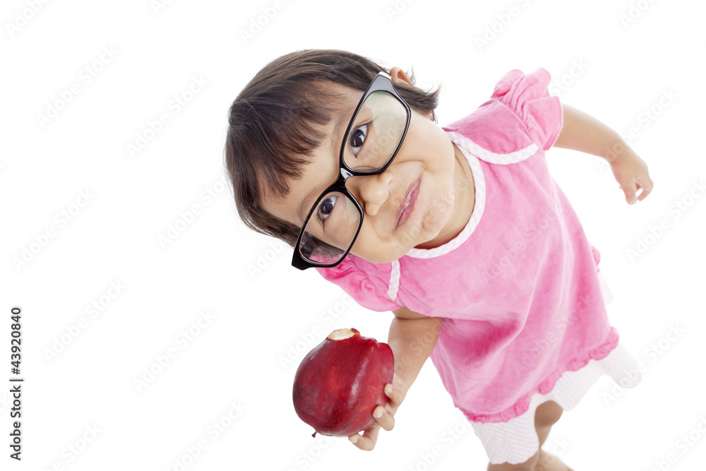 Little pupil eating apple