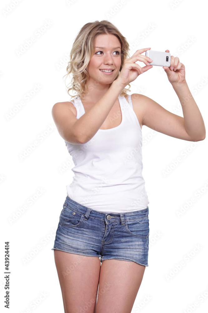 Girl posing for a photograph taken from his cell phone Girl posing for a photograph taken from his cell phone
