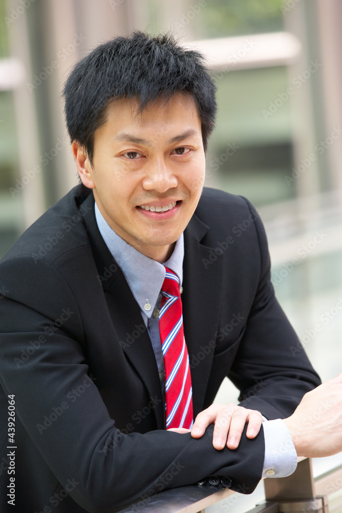 Portrait Of Chinese Businessman Outside Office Portrait Of Chinese Businessman Outside Office