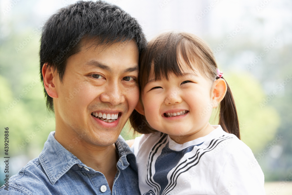 Portrait Of Chinese Father With Daughter In Park Portrait Of Chinese Father With Daughter In Park