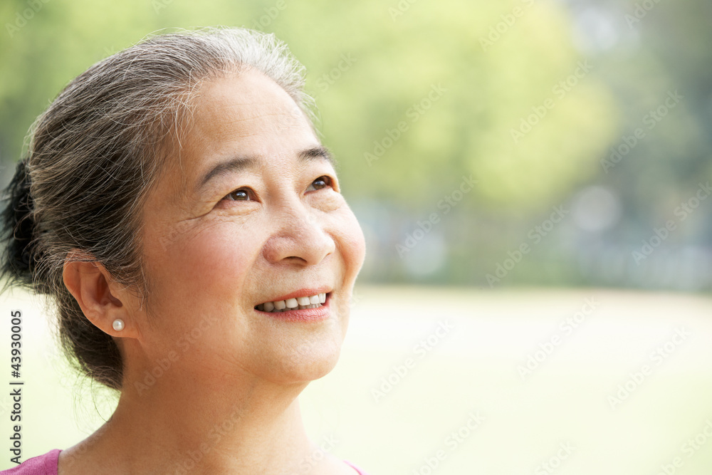 Head And Shoulders Portrait Of Attractive Chinese Senior Woman Head And Shoulders Portrait Of Attractive Chinese Senior Woman