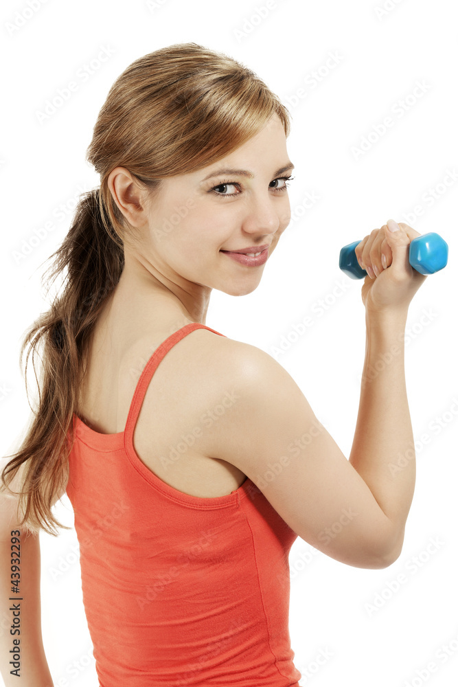 sportlerin mit fitness hantel schaut über die schulter sportlerin mit fitness hantel schaut über die schulter