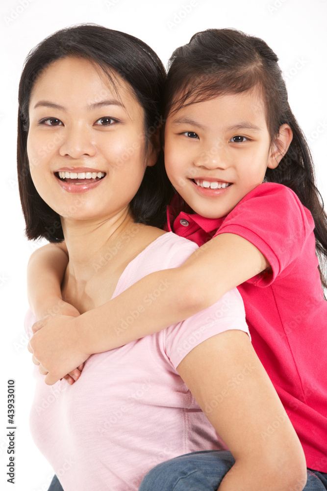 Studio Shot Of Chinese Mother And Daughter