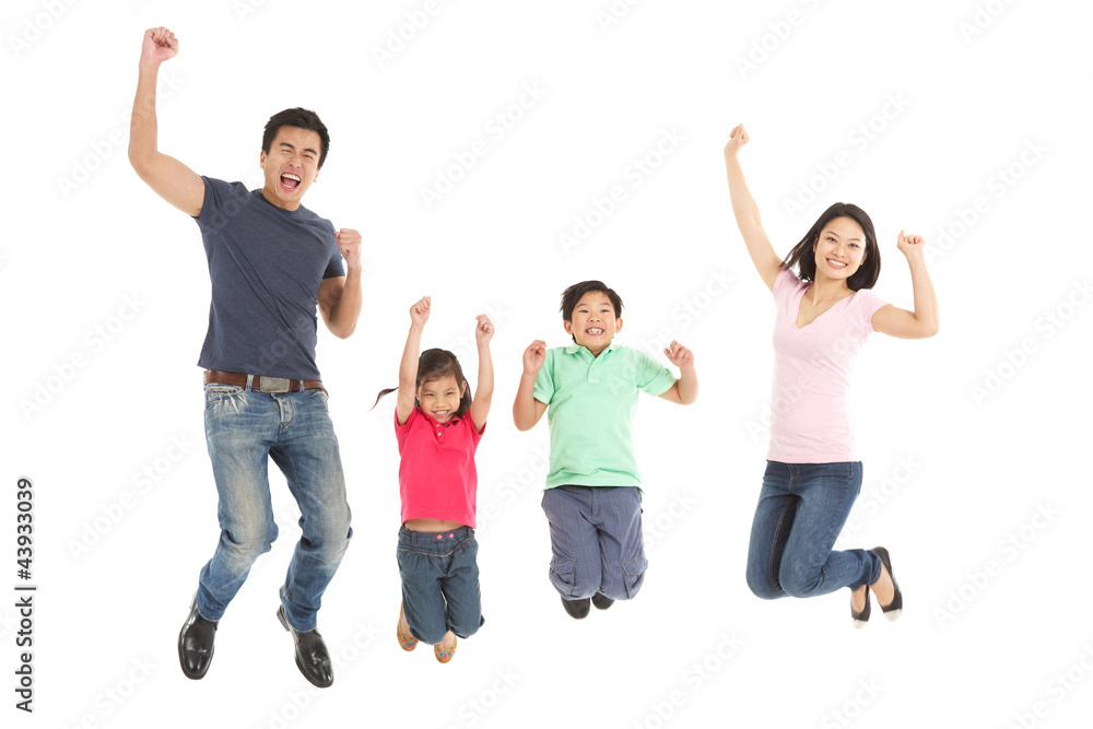Studio Shot Of Chinese Family Jumping In Air Studio Shot Of Chinese Family Jumping In Air