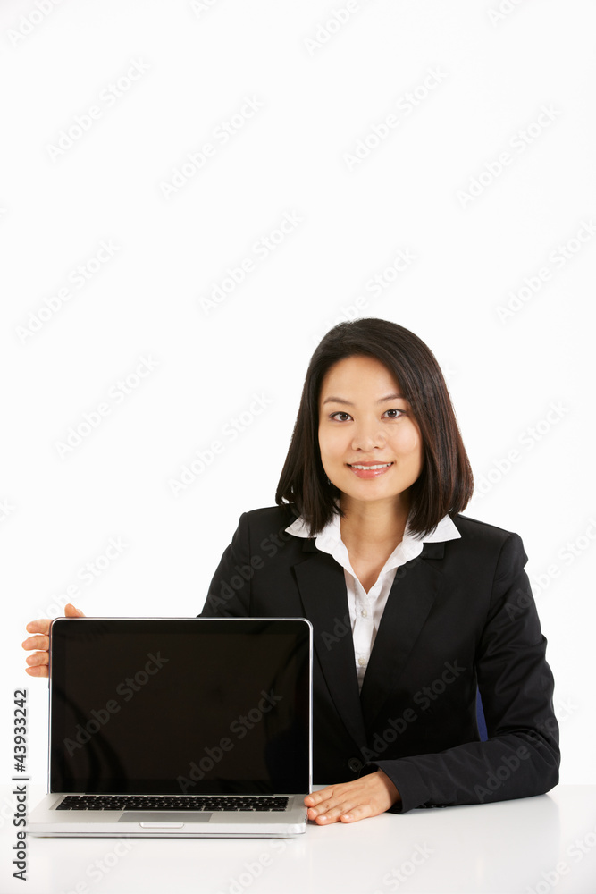 Studio Shot Of Chinese Businesswoman Working On Laptop Studio Shot Of Chinese Businesswoman Working On Laptop