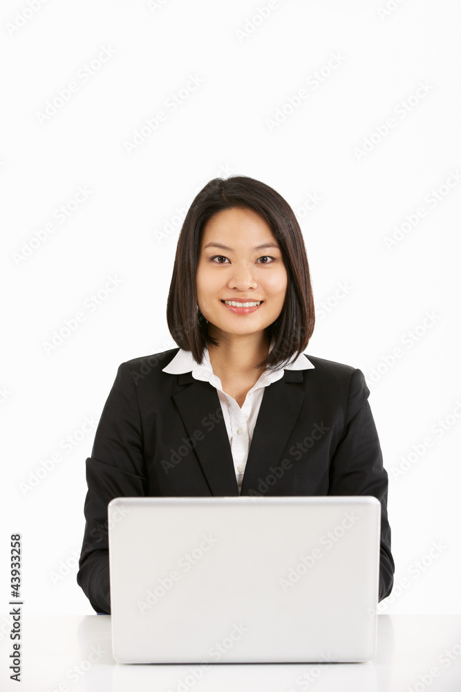 Studio Shot Of Chinese Businesswoman Working On Laptop Studio Shot Of Chinese Businesswoman Working On Laptop