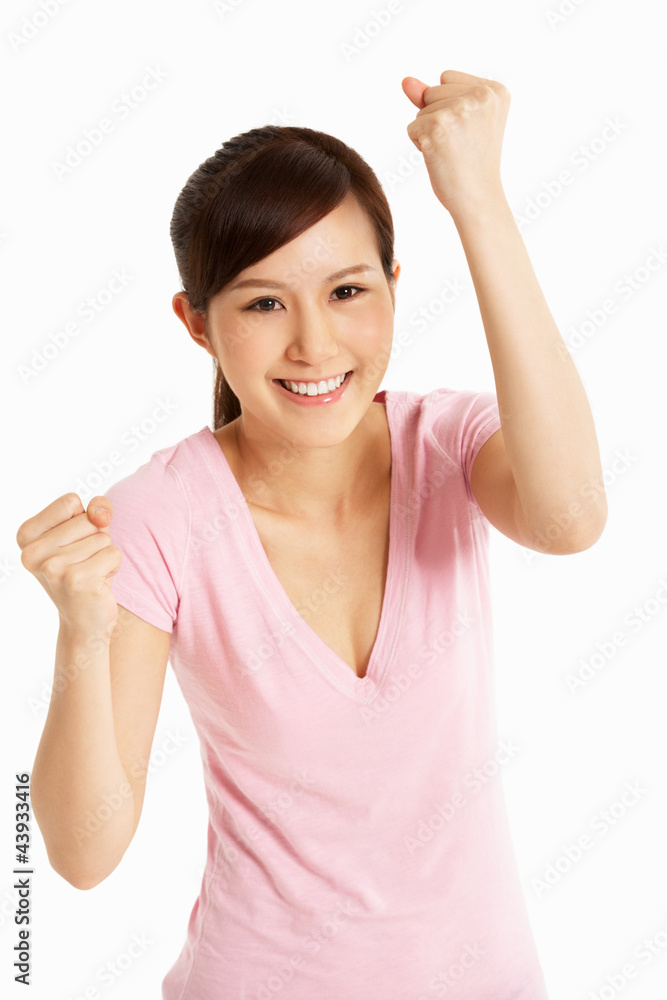 Studio Shot Of Excited Chinese Woman Celebrating Studio Shot Of Excited Chinese Woman Celebrating