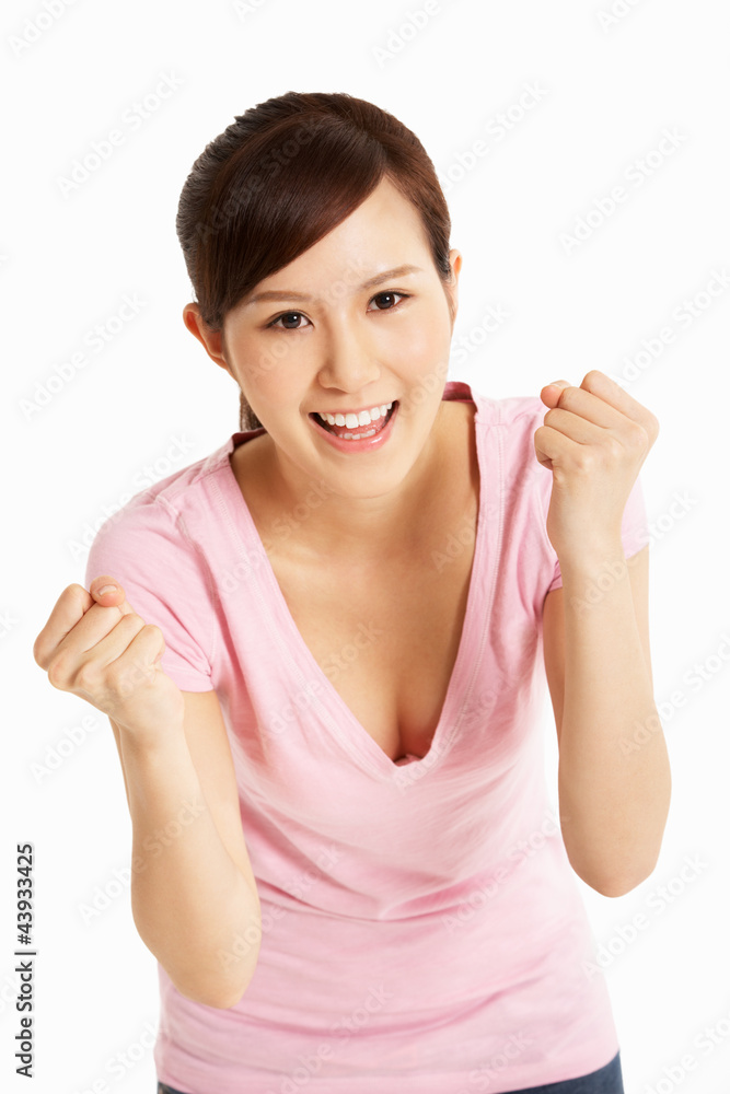 Studio Shot Of Excited Chinese Woman Celebrating Studio Shot Of Excited Chinese Woman Celebrating