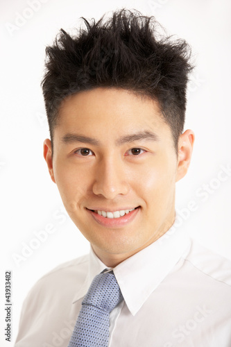 Studio Portrait Of Chinese Businessman