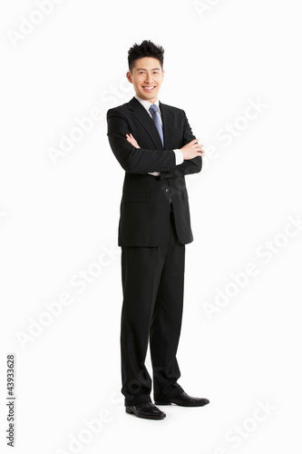 Full Length Studio Portrait Of Chinese Businessman