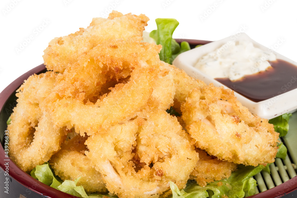 Deep batter fried squid rings calamari with green salad Deep batter fried squid rings calamari with green salad