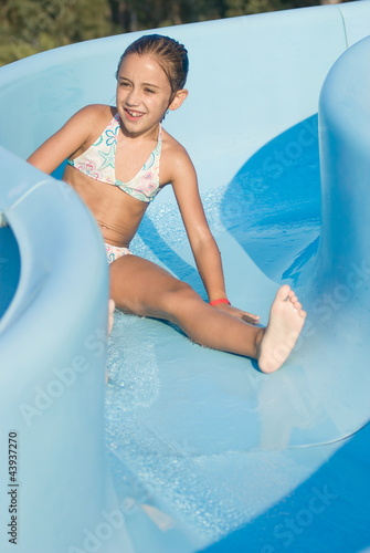 Girl on a water slide photo