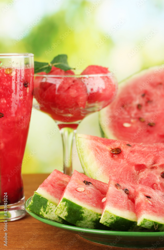 Refreshing desserts of watermelon on green background close-up Refreshing desserts of watermelon on green background close-up