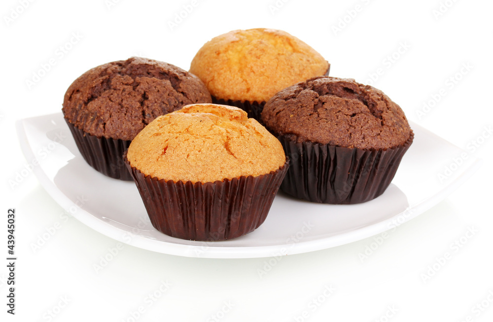 Fresh muffins on plate isolated on white Fresh muffins on plate isolated on white