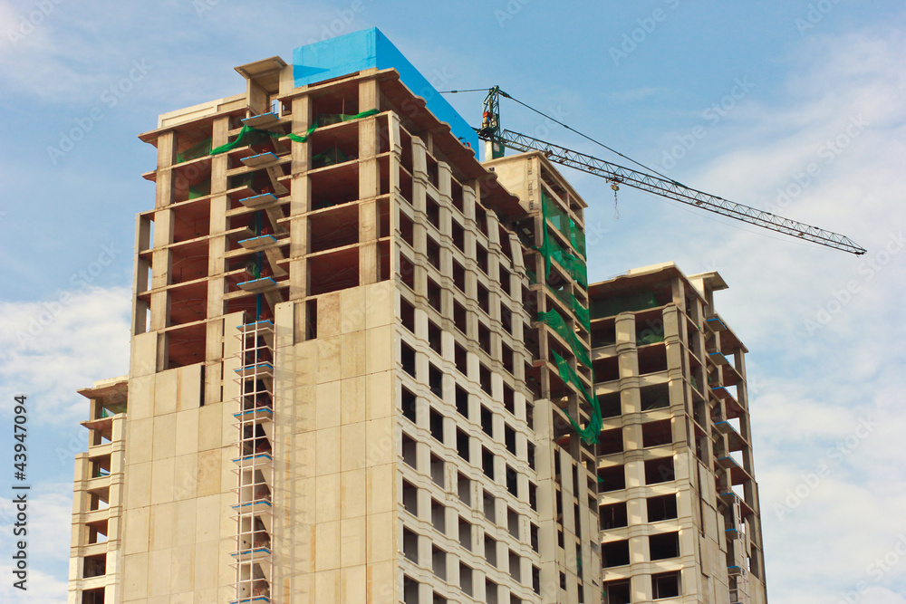 Under construction building with blue sky