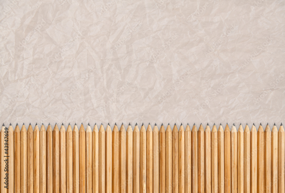 Pencils isolated, texture of paper as background Pencils isolated, texture of paper as background