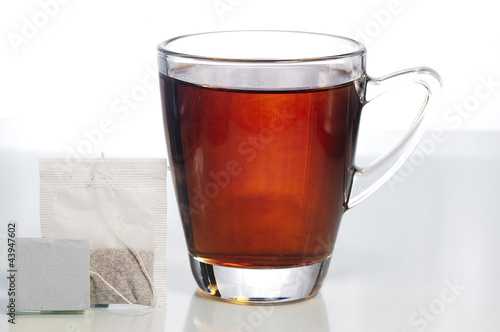 a glass of tea with teabag