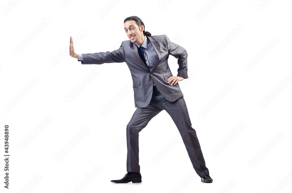 Young businessman pushing invisible obstacles Young businessman pushing invisible obstacles