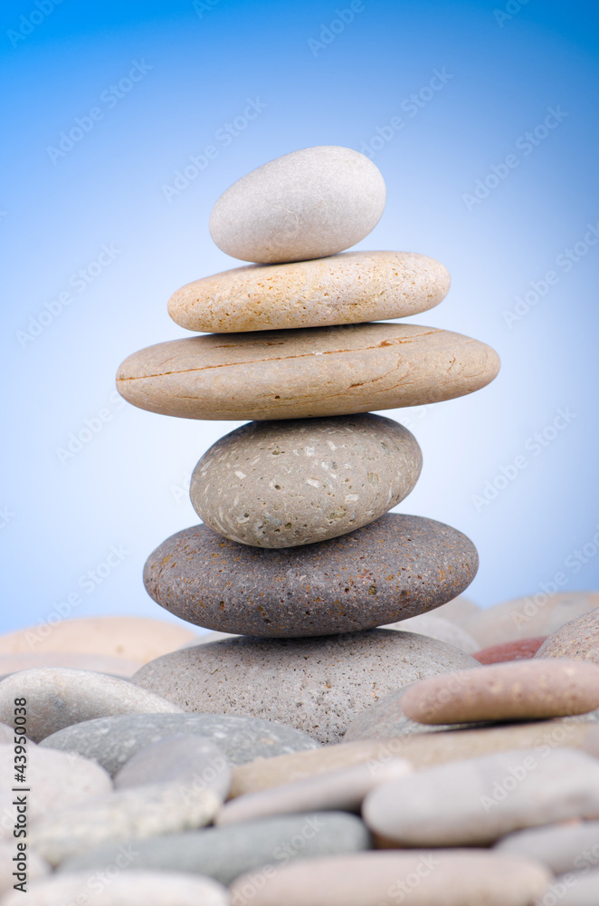Pebbles stack against gradient background Pebbles stack against gradient background