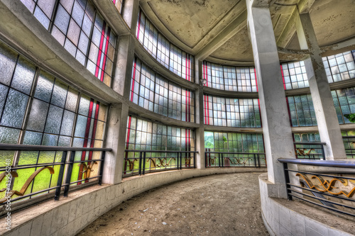 Spiral corridor with large canopy in abandoned sanatorium photo