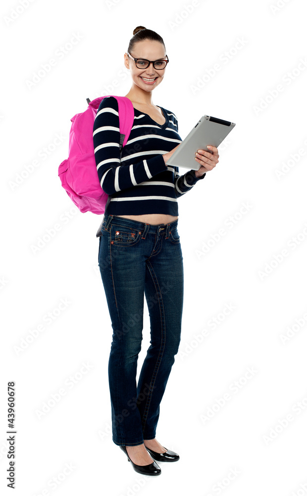 Smiling college girl using tablet pc Smiling college girl using tablet pc