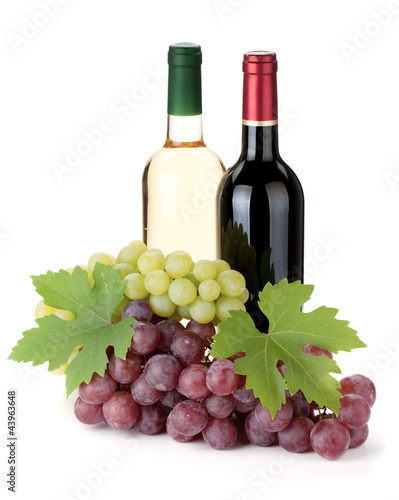 Two wine bottles and grapes