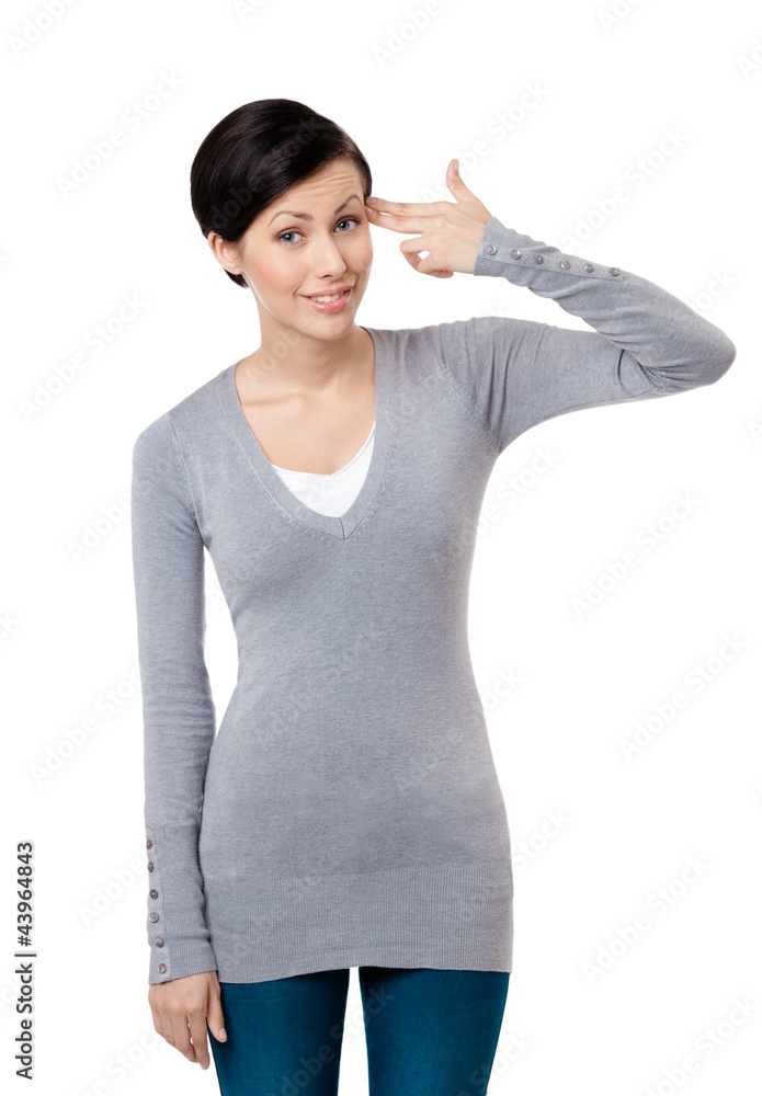 Young girl shows hand gun gesture, isolated on white