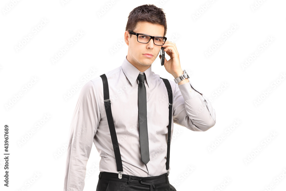 A stylish man holding talking on a mobile phone A stylish man holding talking on a mobile phone