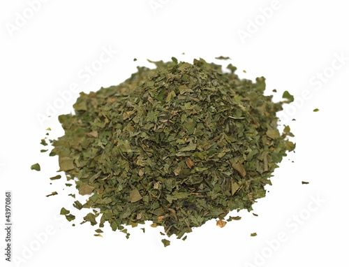 pile celery spice, dried chopped  leaves isolated on white